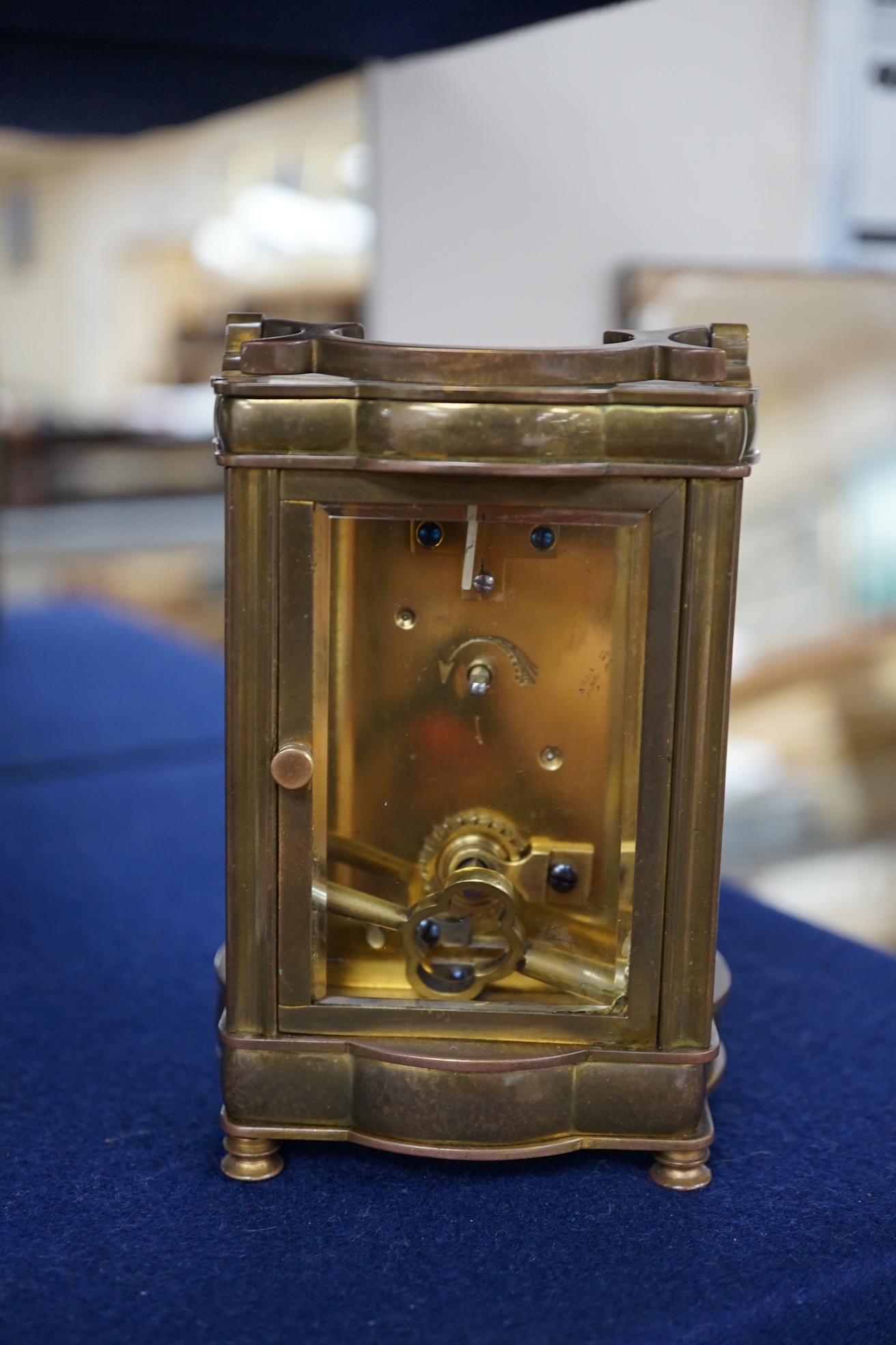 An early 20th century brass carriage timepiece with a fret worked ground, 12cm. Condition - good, but untested if working